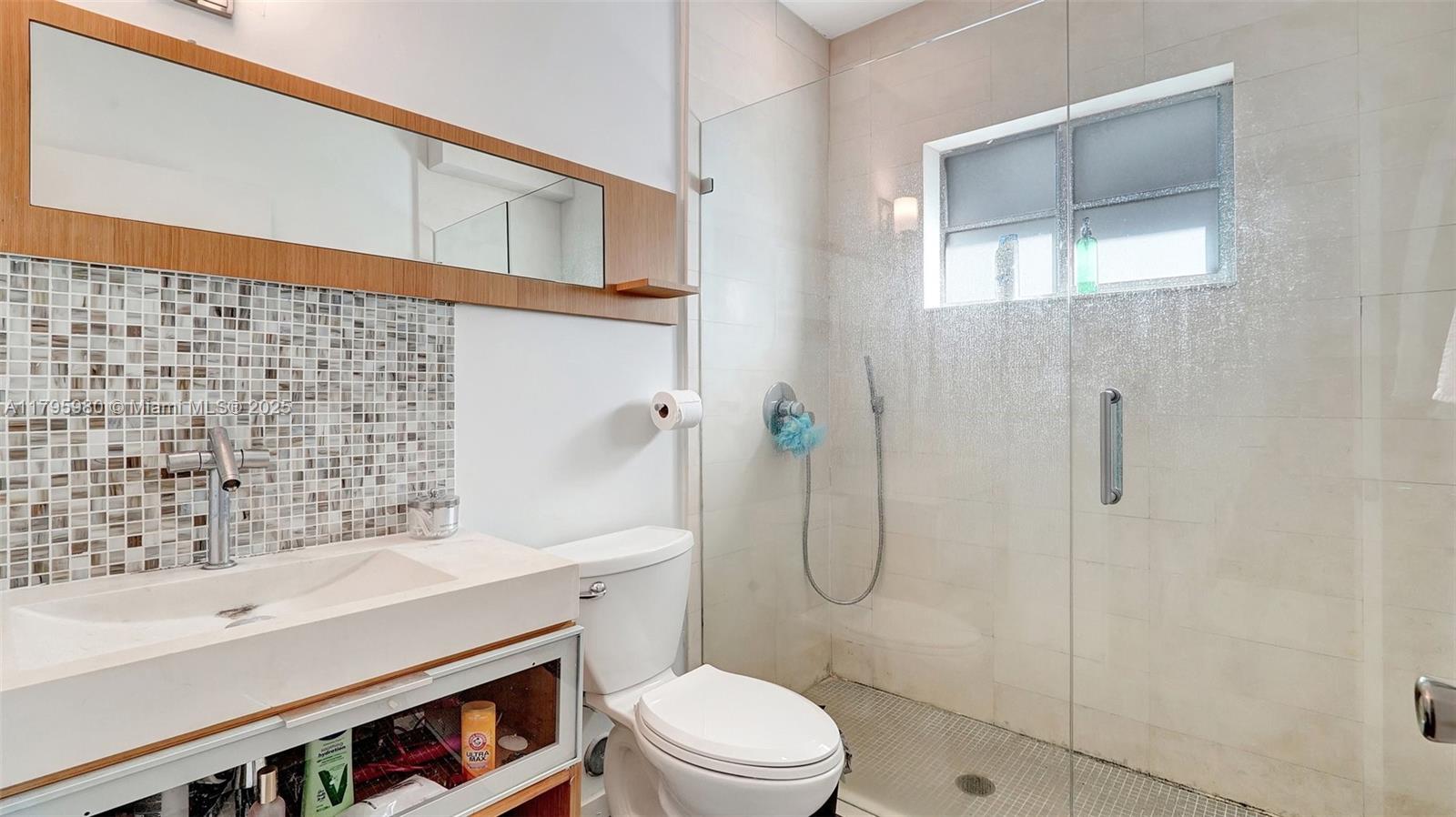 Flamingo-Lummus Miami Beach, FL 33139 - Photo 16 of 63 a bathroom with a sink toilet and shower