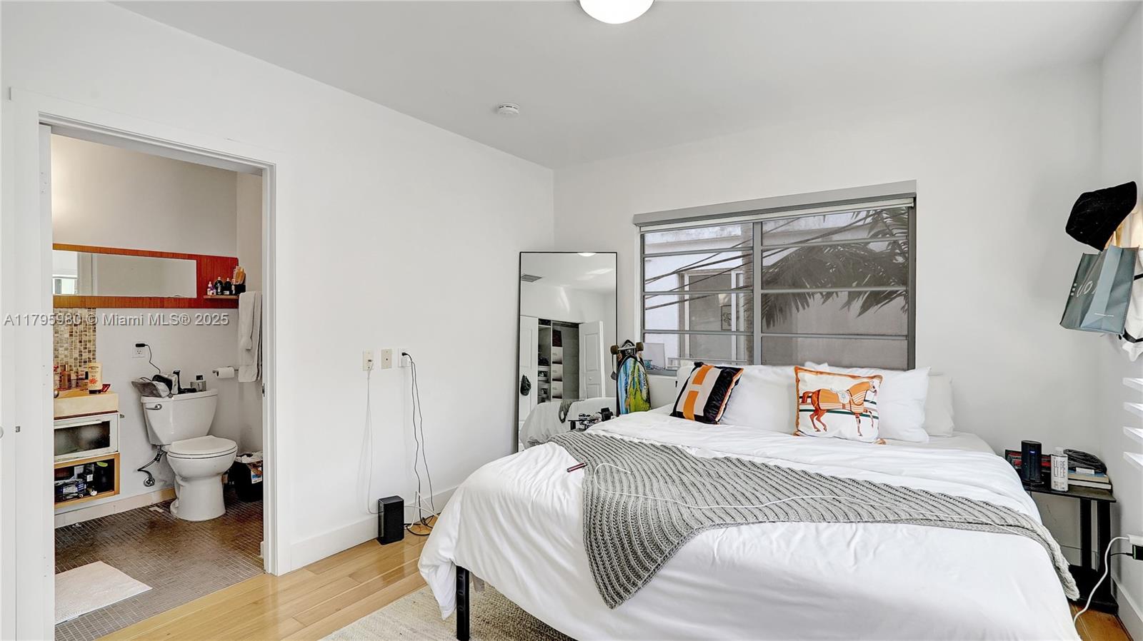 Flamingo-Lummus Miami Beach, FL 33139 - Photo 29 of 63 a bedroom with a bed and wooden floor