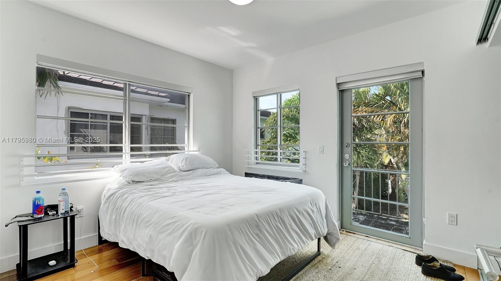 Flamingo-Lummus Miami Beach, FL 33139 - Photo 32 of 63 a bedroom with a bed and a large window