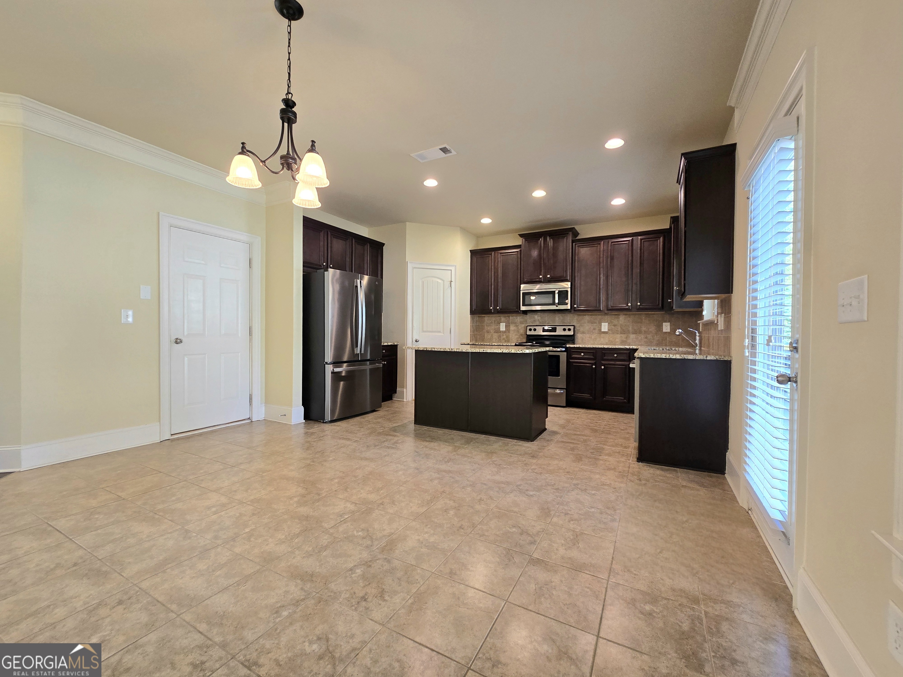 9 Ravine Drive Newnan, GA 30265 - Photo 14 of 46 a view of a kitchen with a sink and microwave
