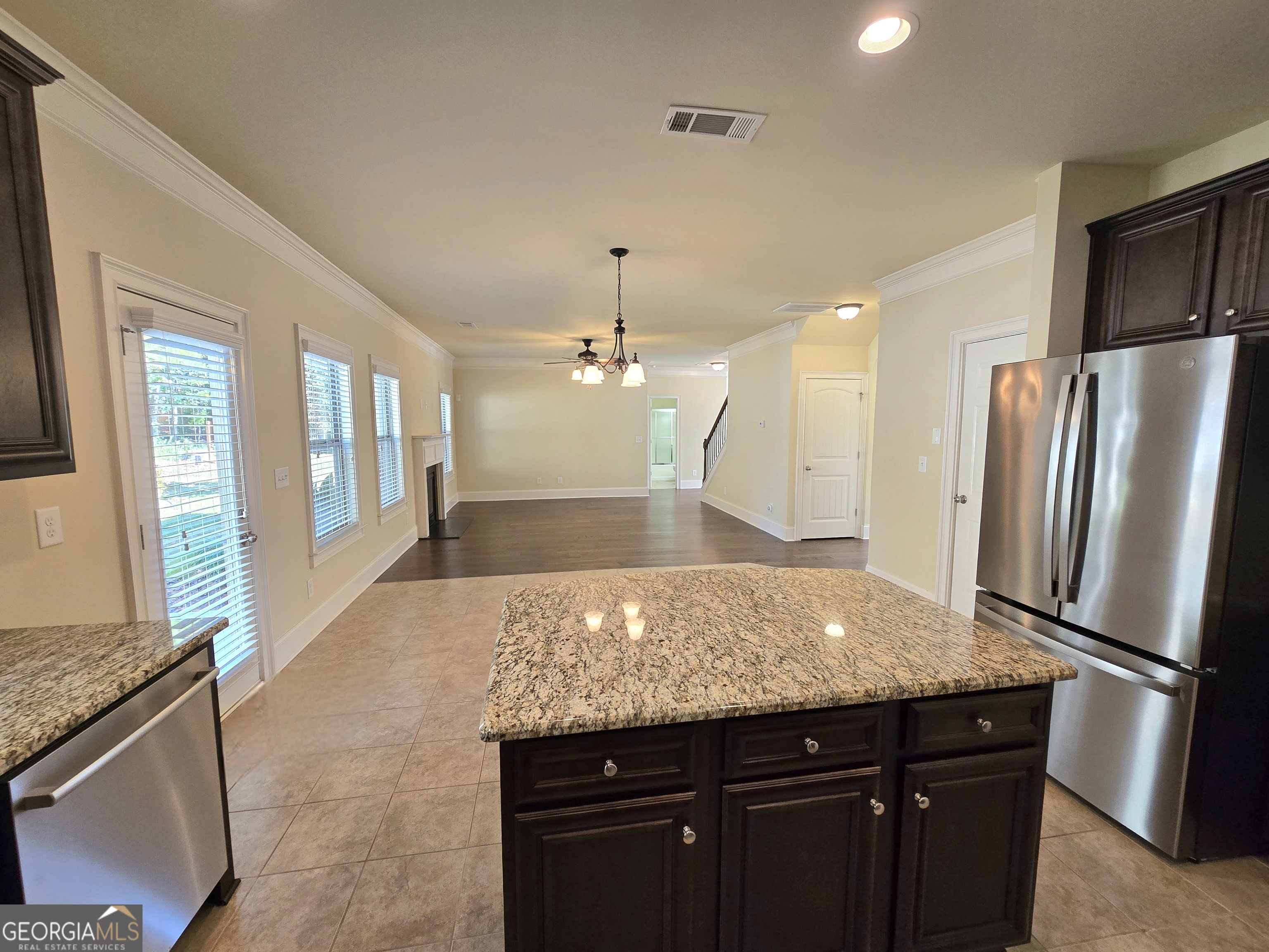 9 Ravine Drive Newnan, GA 30265 - Photo 15 of 46 a kitchen with granite countertop a refrigerator and a sink