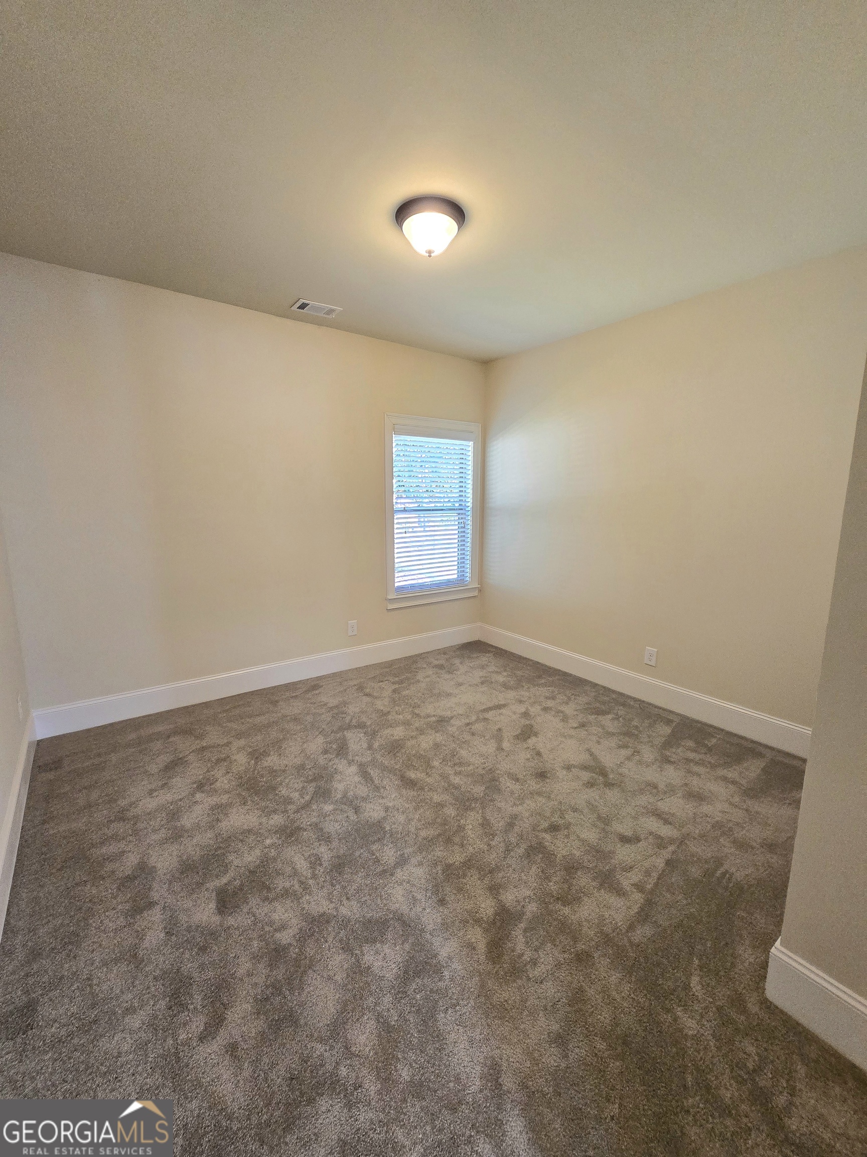 9 Ravine Drive Newnan, GA 30265 - Photo 16 of 46 an empty room with a natural light