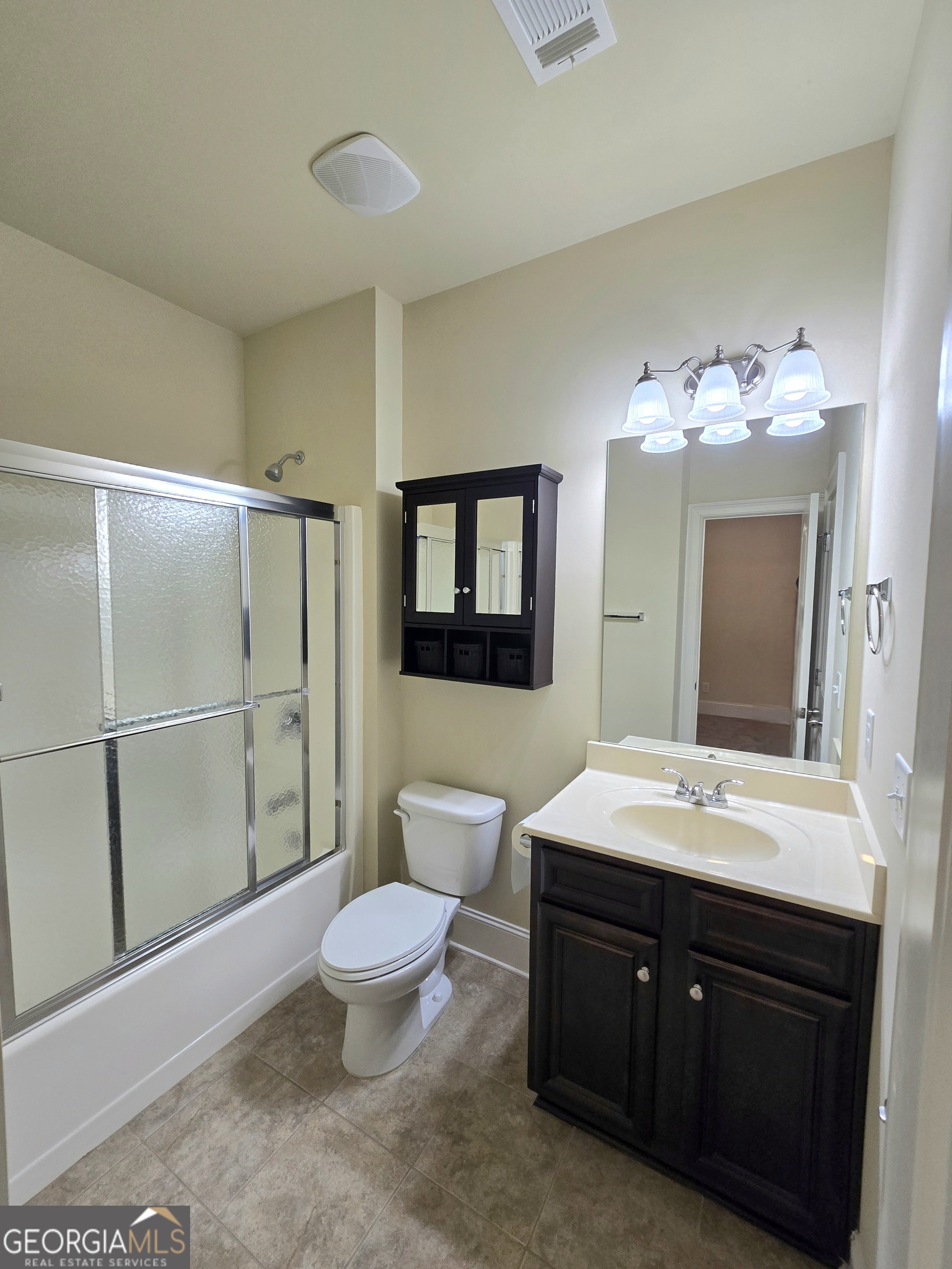 9 Ravine Drive Newnan, GA 30265 - Photo 17 of 46 a spacious bathroom with a double vanity sink toilet mirror and shower