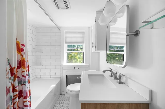 a bathroom with a glass shower