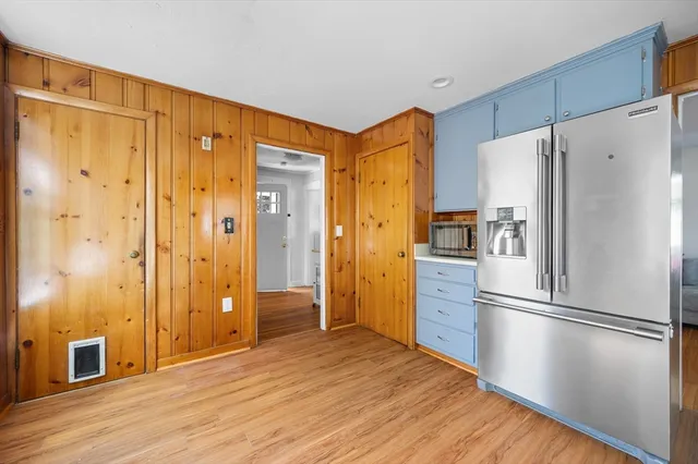 a kitchen with stainless steel appliances a refrigerator and a stove top oven