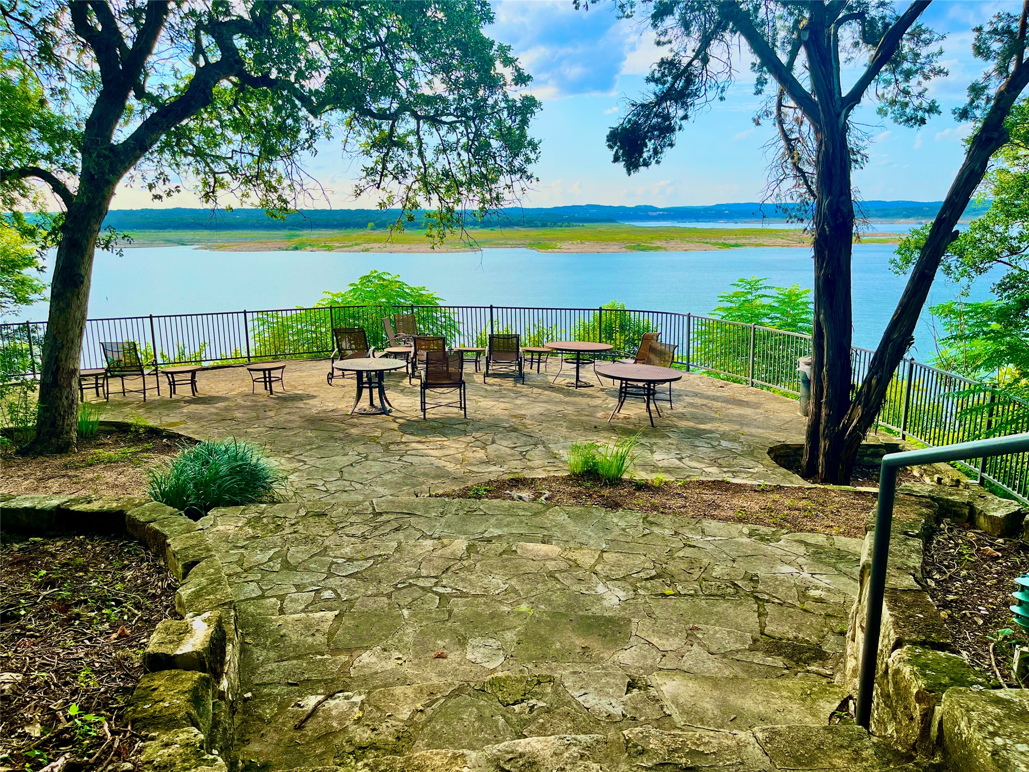2918 Ranch Road 620, Unit 297 Austin, TX 78734 - Photo 35 of 37 View of home's community featuring a water view and a patio