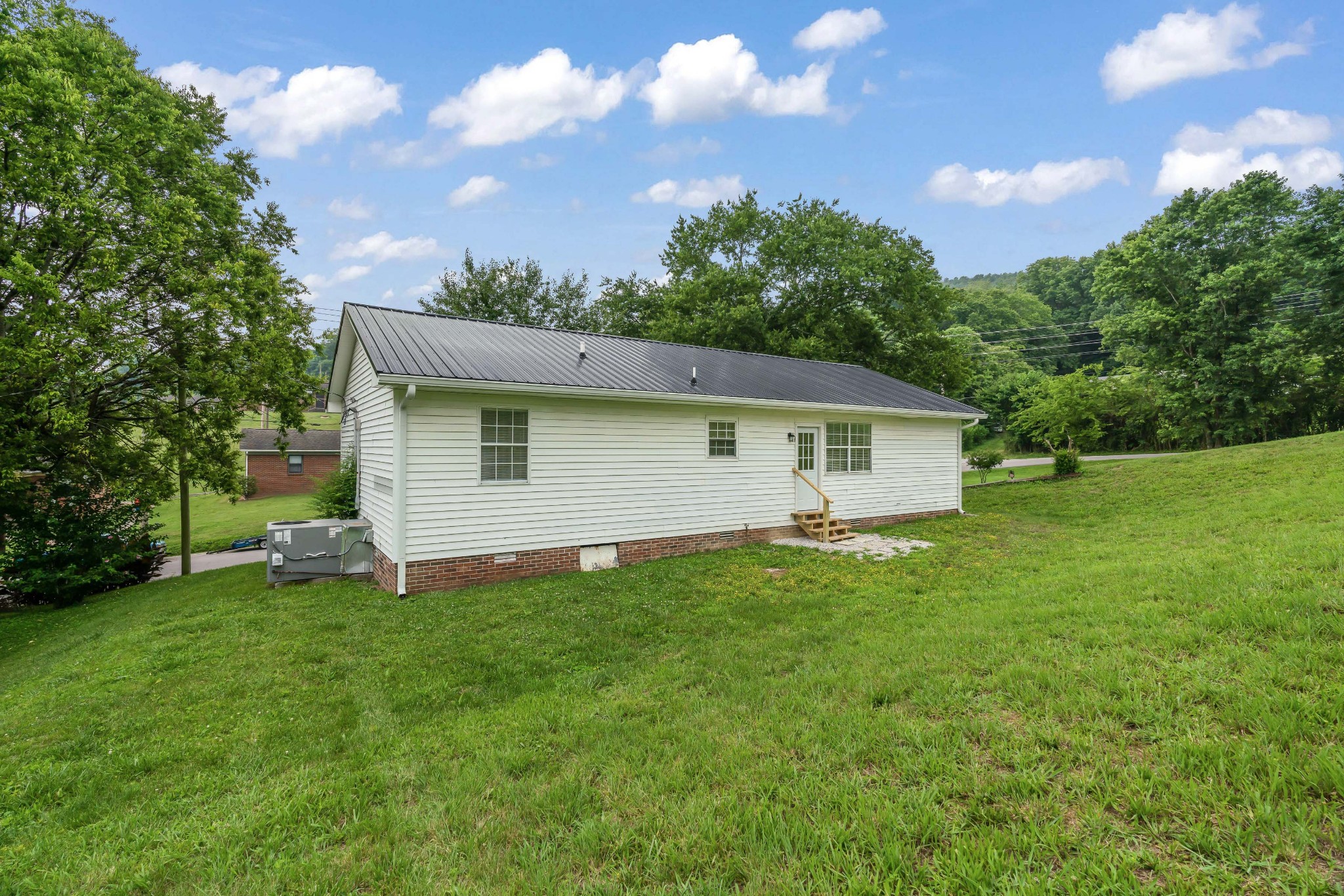 183 Cedar Street Carthage, TN 37030 - Photo 18 of 18 a view of a backyard with a garden