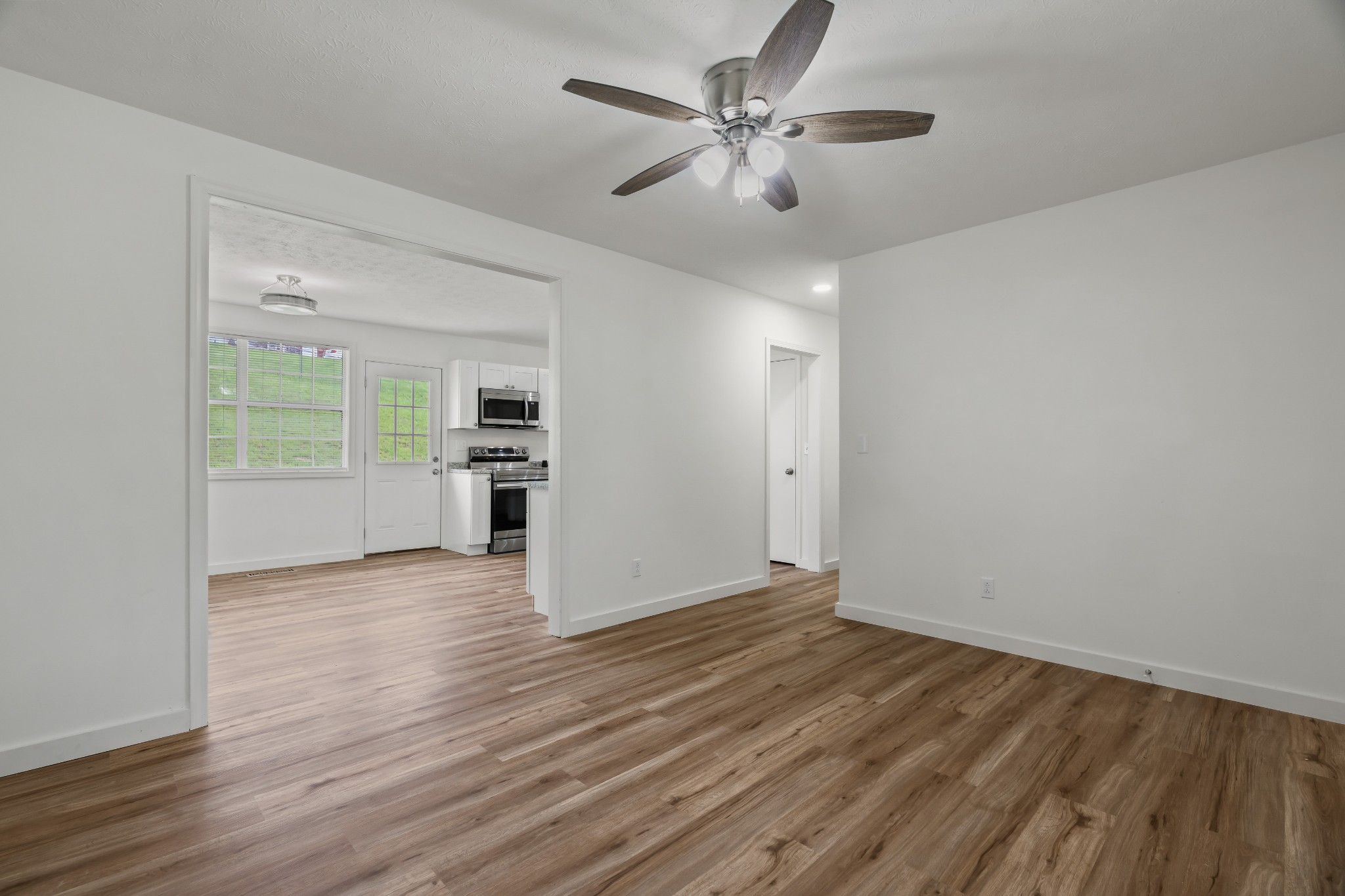 183 Cedar Street Carthage, TN 37030 - Photo 5 of 18 wooden floor in an empty room with a window
