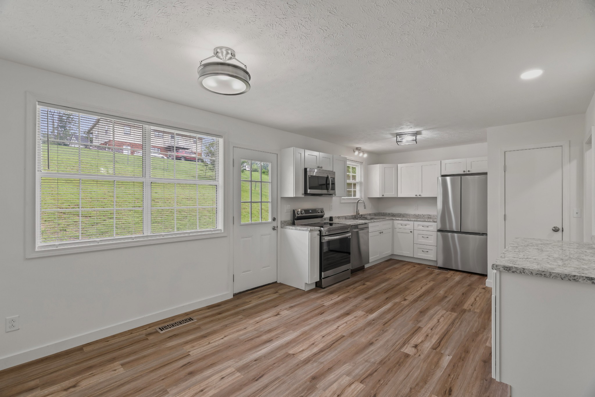 183 Cedar Street Carthage, TN 37030 - Photo 6 of 18 a kitchen with a refrigerator and a stove top oven