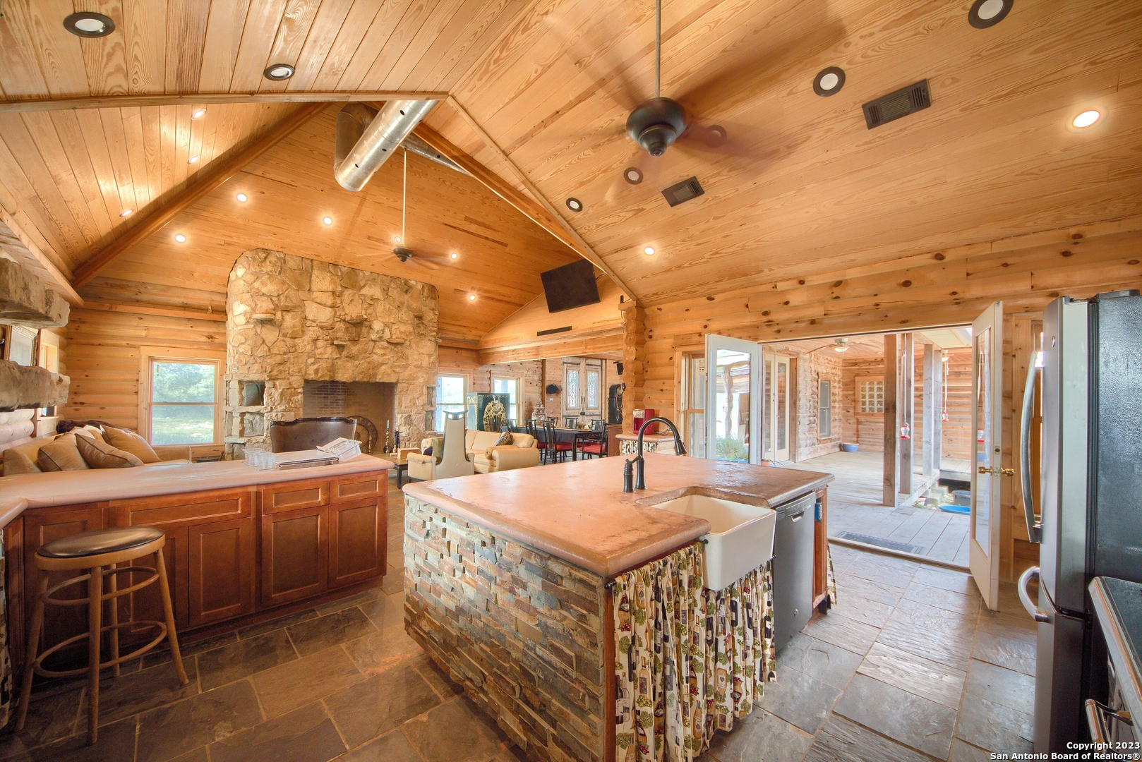 514 Centerfork Road Doss, TX 78618 - Photo 15 of 51 a large kitchen with kitchen island a large window and stainless steel appliances