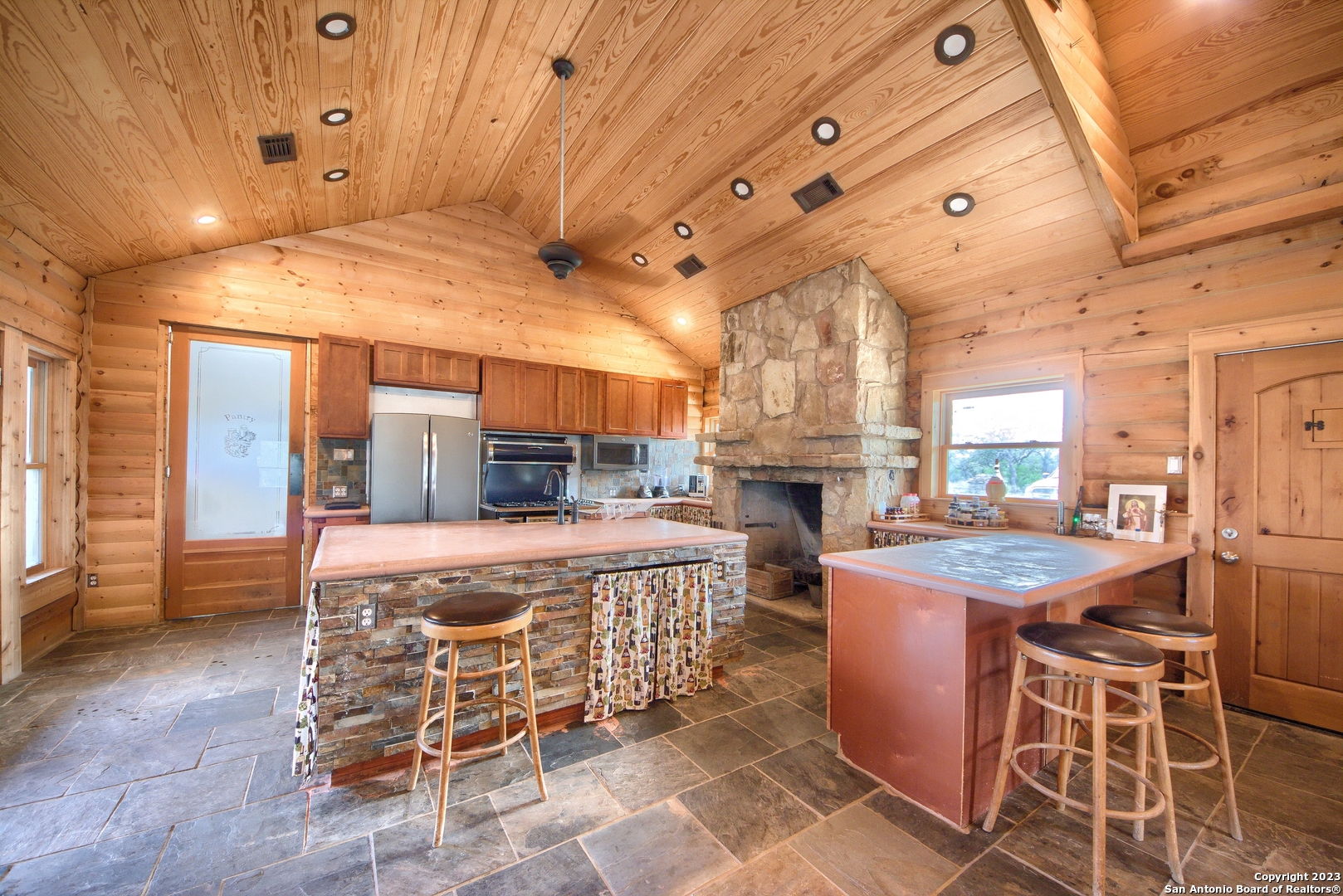 514 Centerfork Road Doss, TX 78618 - Photo 16 of 51 a room with lots of table and chairs