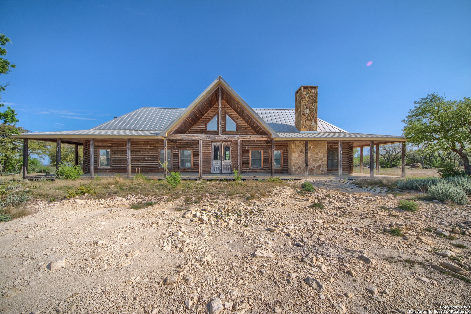 514 Centerfork Road Doss, TX 78618 - Photo 17 of 51 a front view of a house with a garden