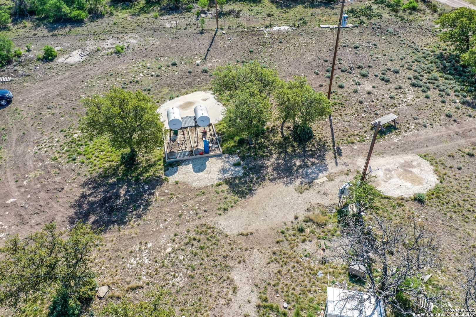 514 Centerfork Road Doss, TX 78618 - Photo 21 of 51 a view of a yard with plants and trees
