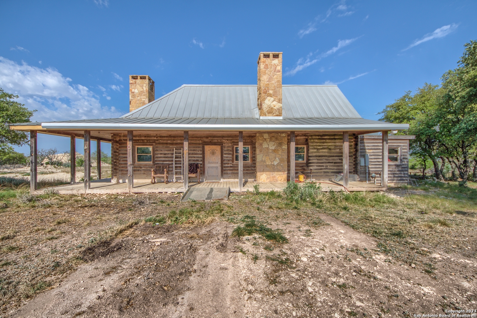 514 Centerfork Road Doss, TX 78618 - Photo 27 of 51 a front view of a house with garden