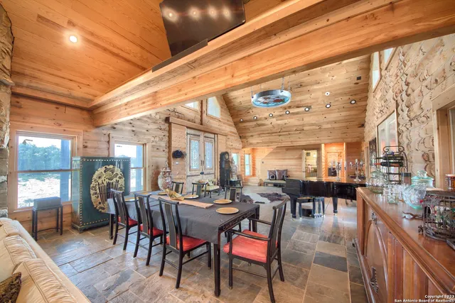 a view of a dining room with furniture window and outdoor kitchen