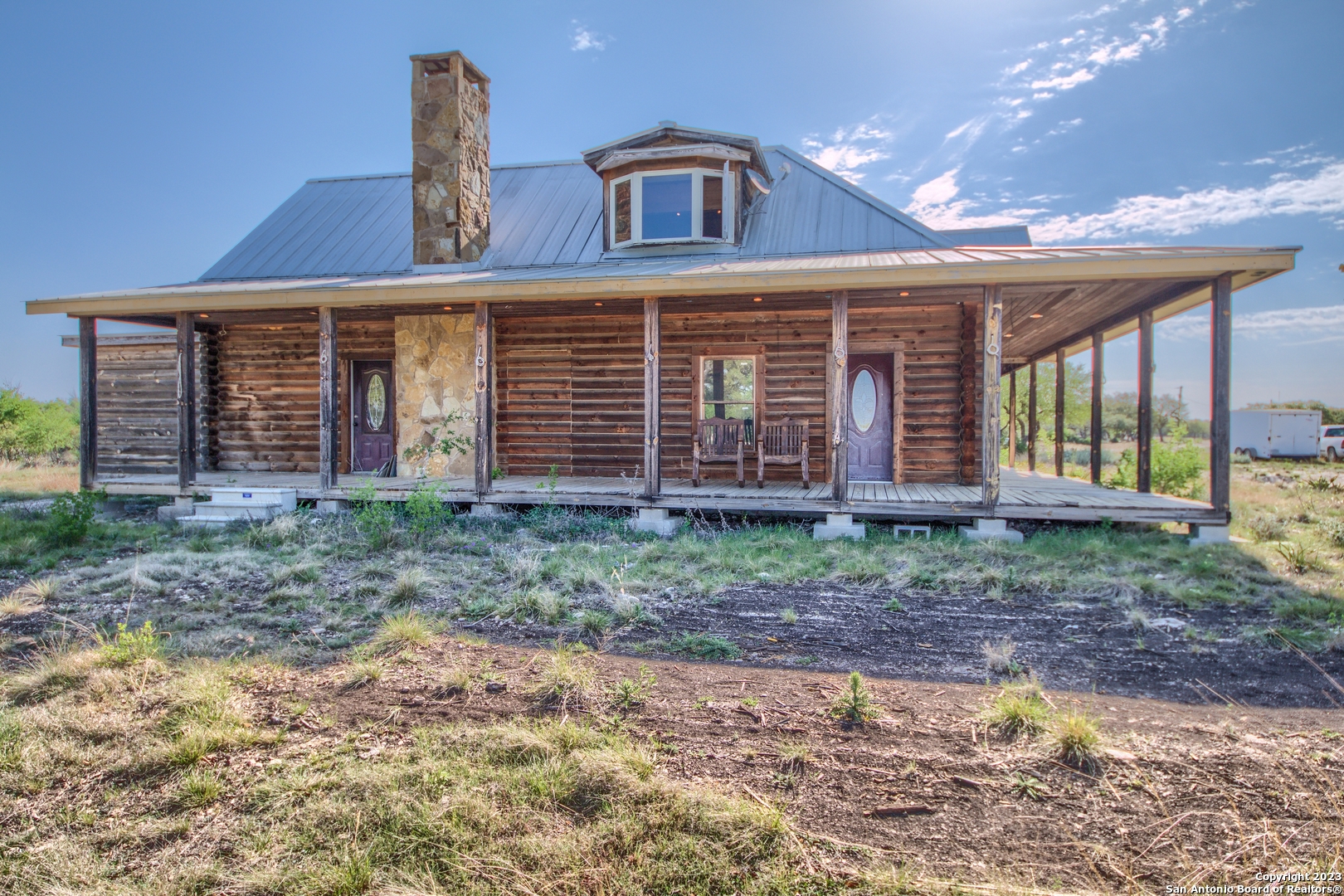 514 Centerfork Road Doss, TX 78618 - Photo 46 of 51 a view of a house with a yard and wooden fence