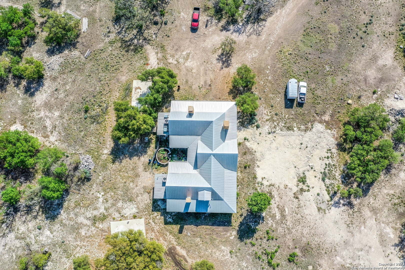 514 Centerfork Road Doss, TX 78618 - Photo 8 of 51 an aerial view of a house with a yard and trees