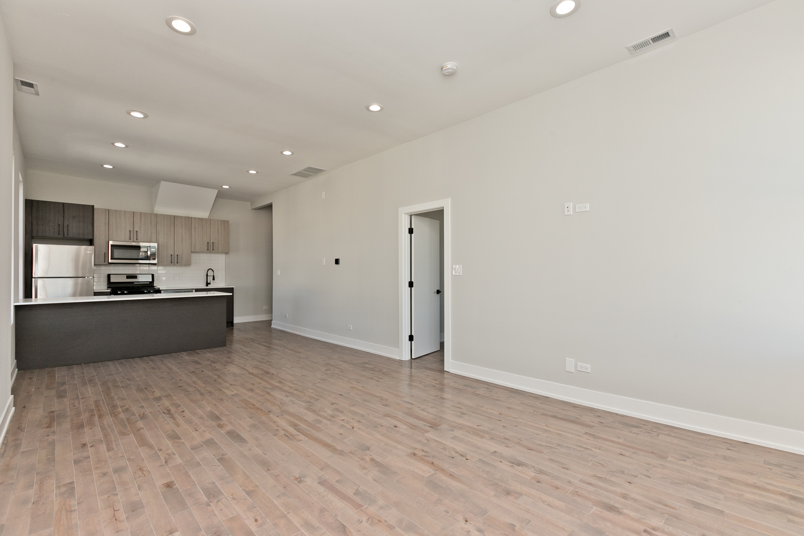 1925 South May Street, Unit 3F Chicago, IL 60608 - Photo 4 of 10 a view of kitchen with wooden floor