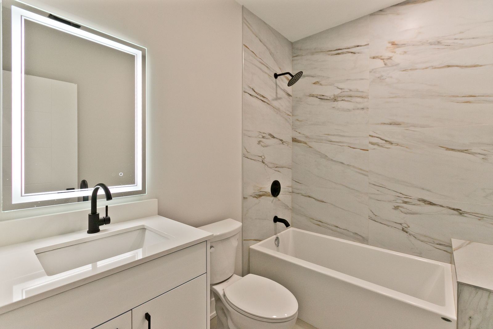 1925 South May Street, Unit 3F Chicago, IL 60608 - Photo 6 of 10 a bathroom with a sink a toilet and a bathtub