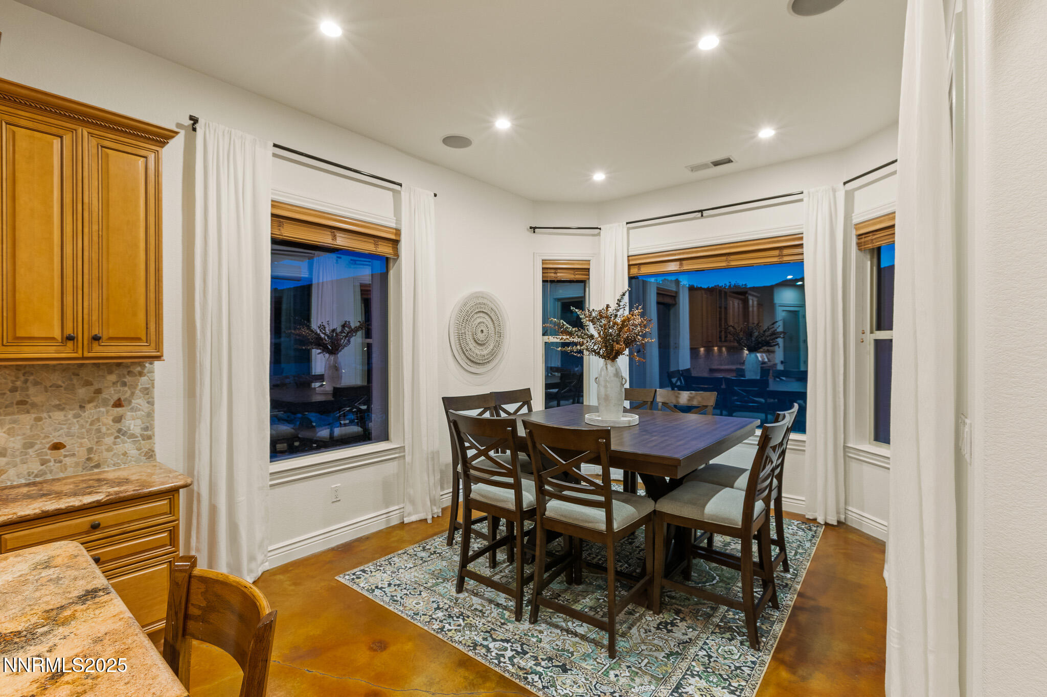 6805 Sage Canyon Road Reno, NV 89510 - Photo 15 of 40 a view of a dining room with furniture and window