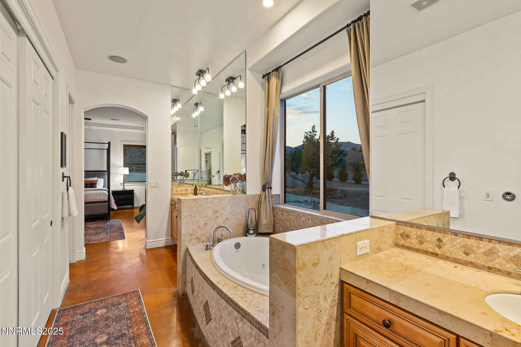 6805 Sage Canyon Road Reno, NV 89510 - Photo 19 of 40 a spacious bathroom with a granite countertop sink mirror and bathtub