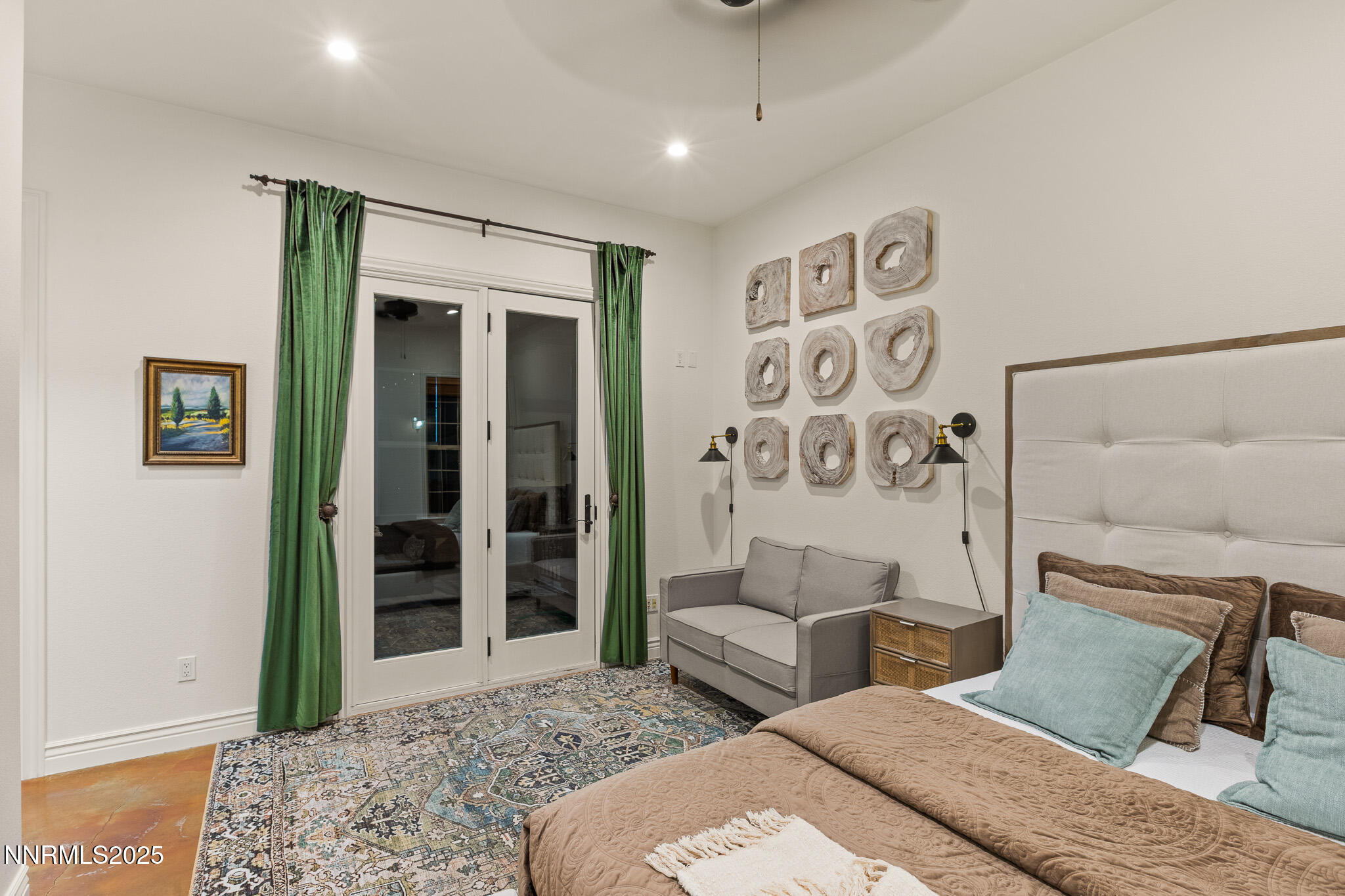6805 Sage Canyon Road Reno, NV 89510 - Photo 23 of 40 a bedroom with a large bed and a couch