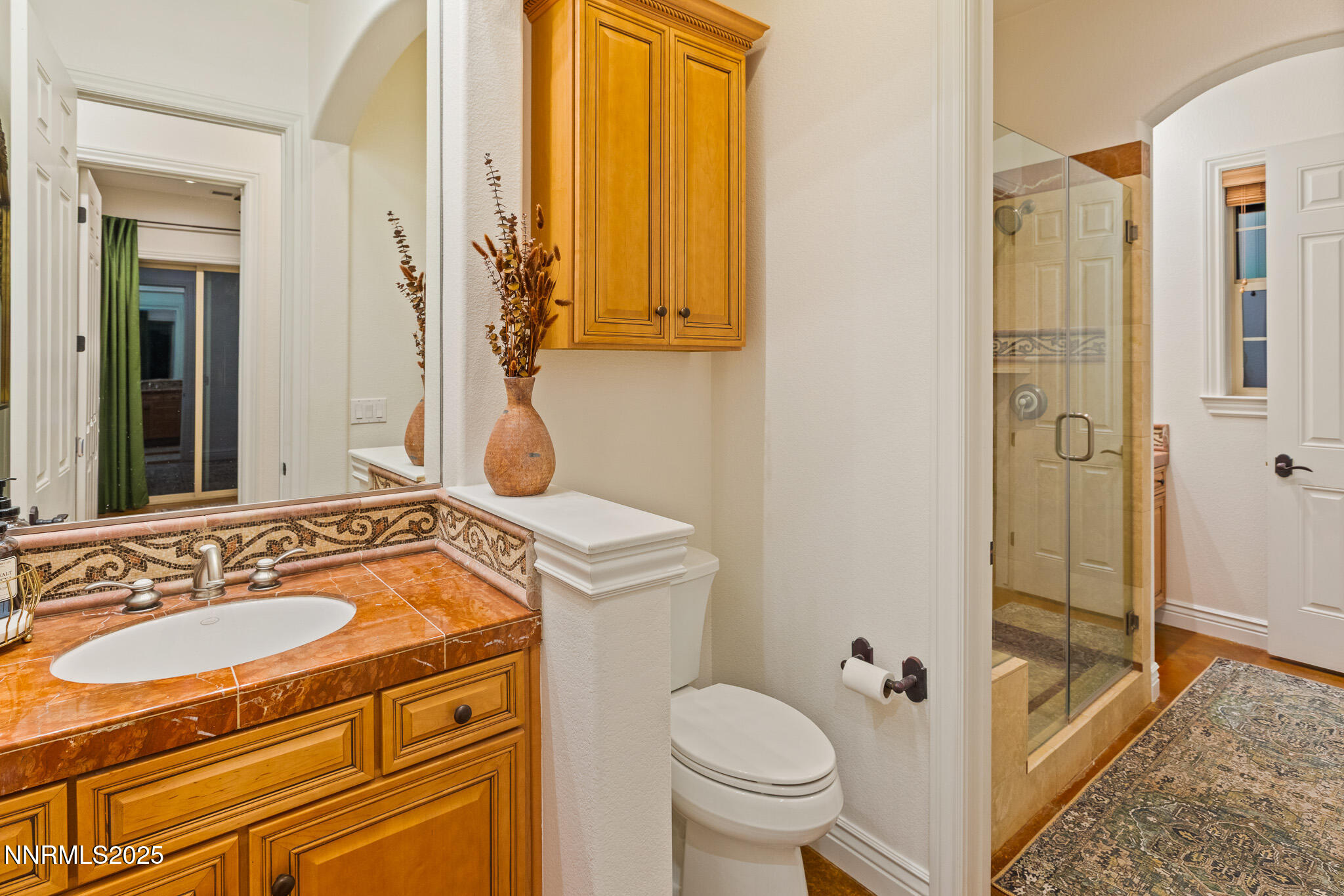6805 Sage Canyon Road Reno, NV 89510 - Photo 25 of 40 a bathroom with a sink a toilet and shower