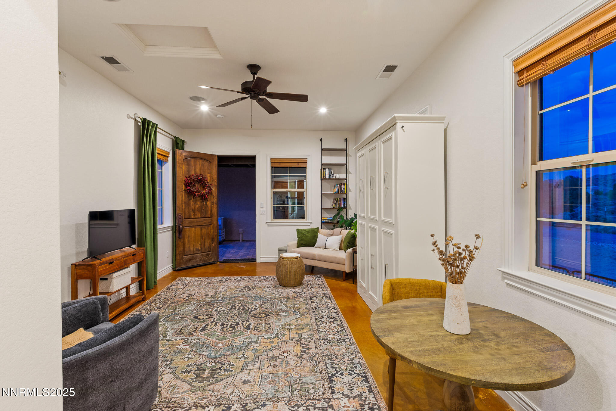 6805 Sage Canyon Road Reno, NV 89510 - Photo 27 of 40 a living room with furniture and a dining table
