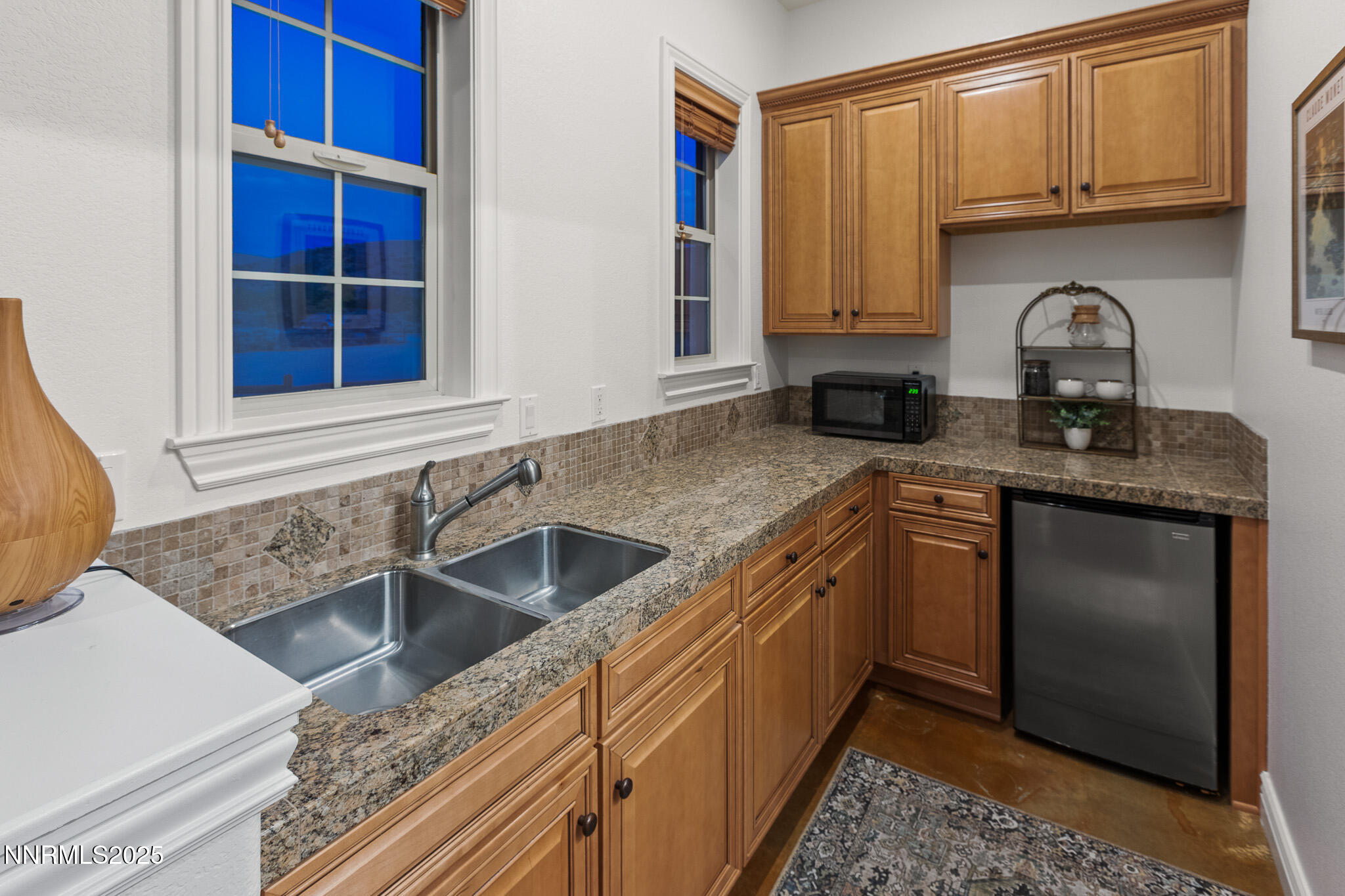 6805 Sage Canyon Road Reno, NV 89510 - Photo 31 of 40 a kitchen with stainless steel appliances granite countertop a sink stove and cabinets