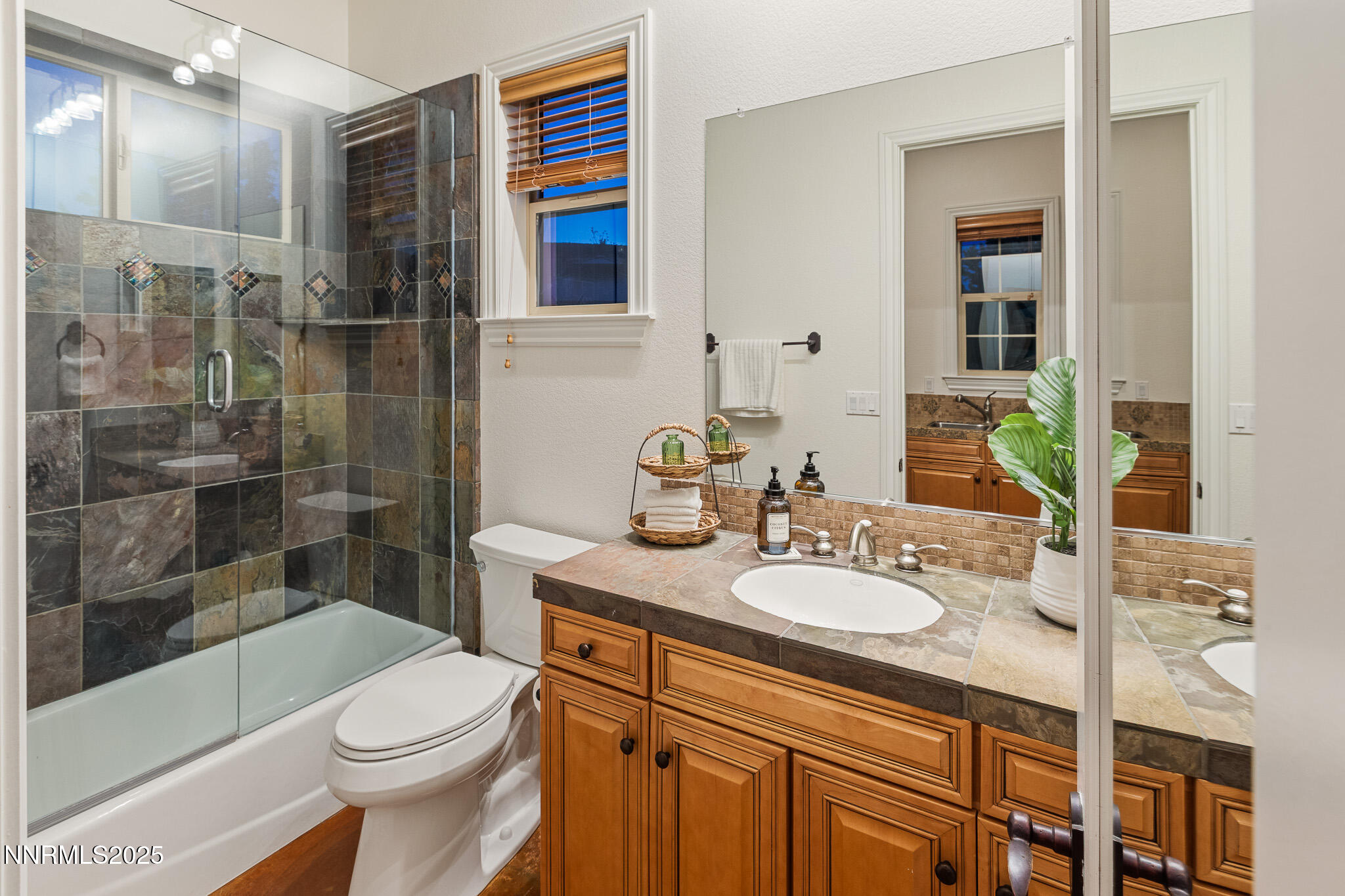 6805 Sage Canyon Road Reno, NV 89510 - Photo 32 of 40 a bathroom with a sink a toilet and shower
