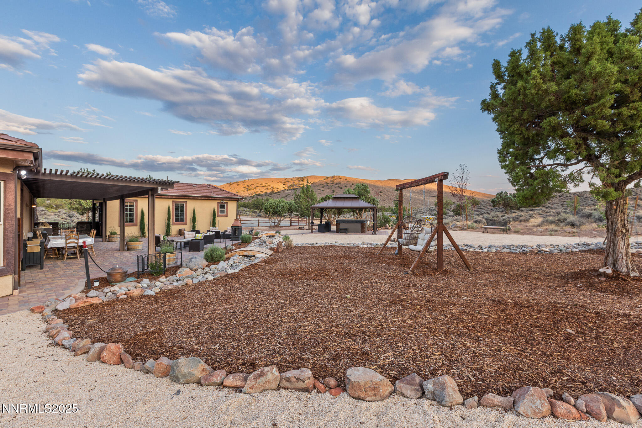 6805 Sage Canyon Road Reno, NV 89510 - Photo 36 of 40 a view of a house with backyard porch and sitting area