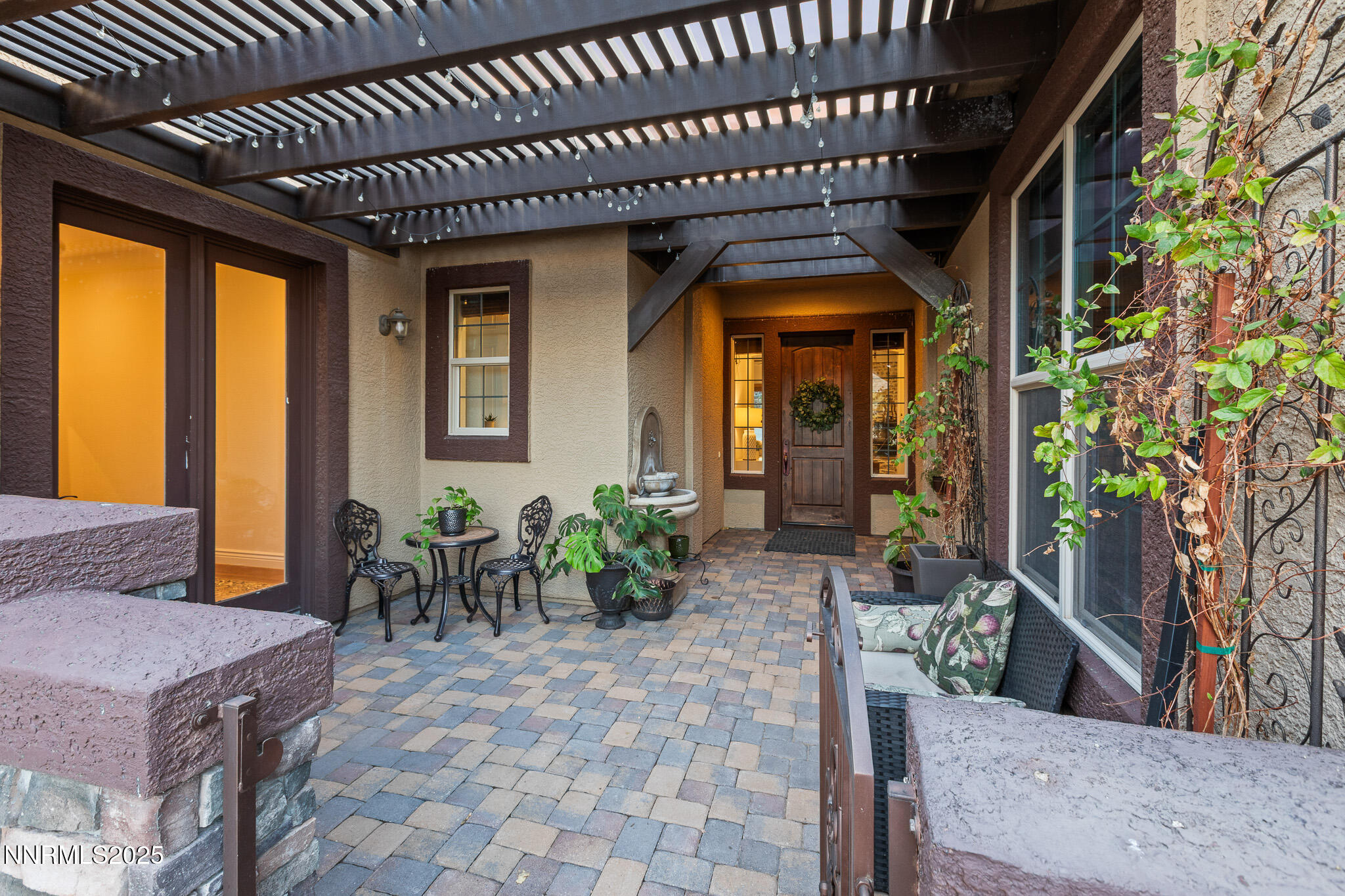 6805 Sage Canyon Road Reno, NV 89510 - Photo 7 of 40 a view of a porch with chairs and potted plants