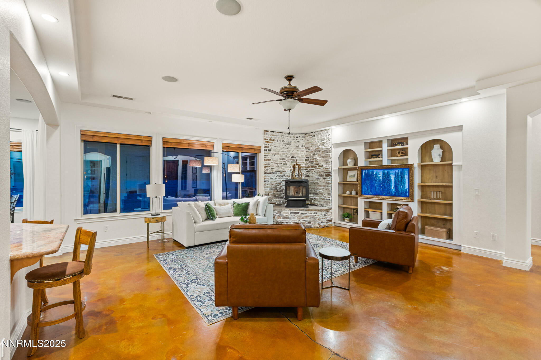 6805 Sage Canyon Road Reno, NV 89510 - Photo 9 of 40 a living room with furniture and a flat screen tv