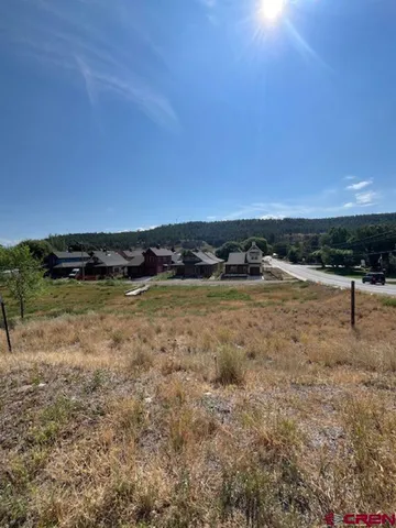 a view of a lake with houses in the back