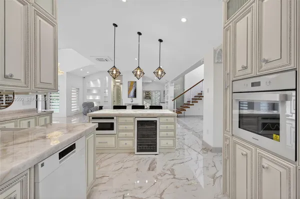 a bathroom with a tub shower and a sink