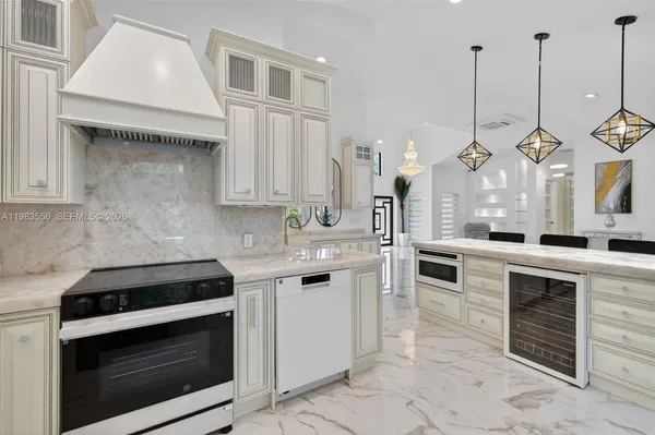 a bedroom with a large bed and a flat tv screen