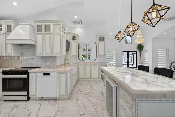 a bedroom with two large bed and a window