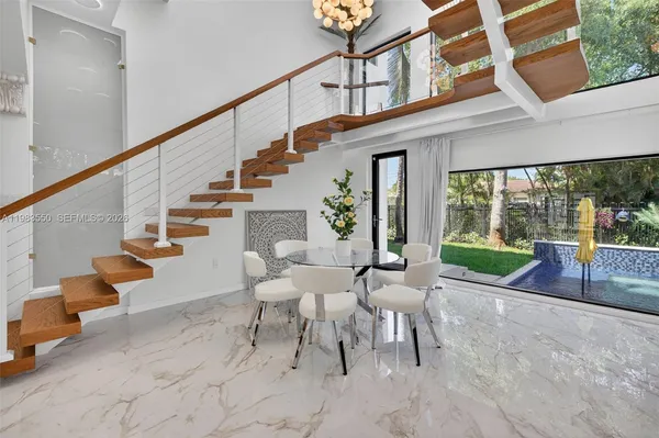 a bedroom with two beds and painting on the wall