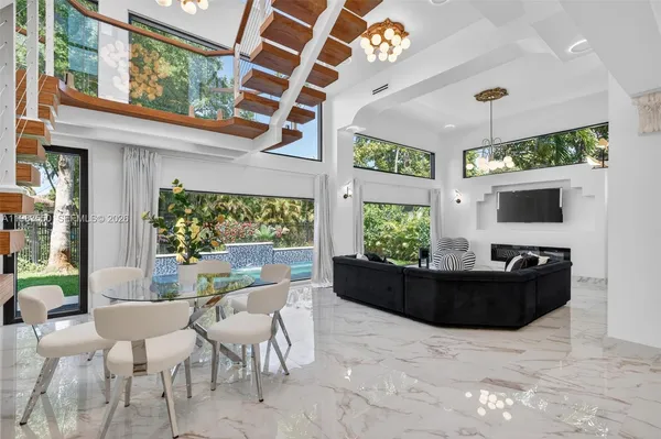 a white bath tub sitting next to a white toilet