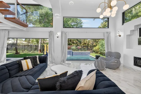 a bedroom with two beds and a window