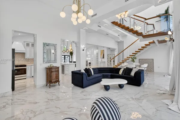 a spacious bedroom with a bed and a couch