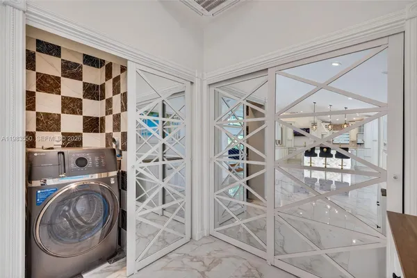 a bedroom with a bed and a wall painting