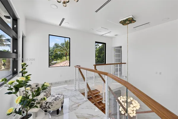 an aerial view of a house with a yard and garden