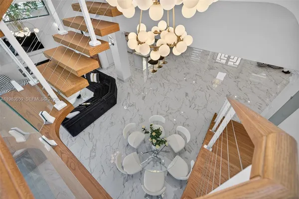 an aerial view of a house with a yard