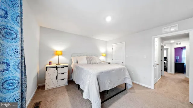 a bedroom with a bed and a cabinets