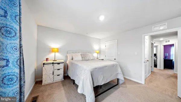 a bedroom with a bed and a cabinets
