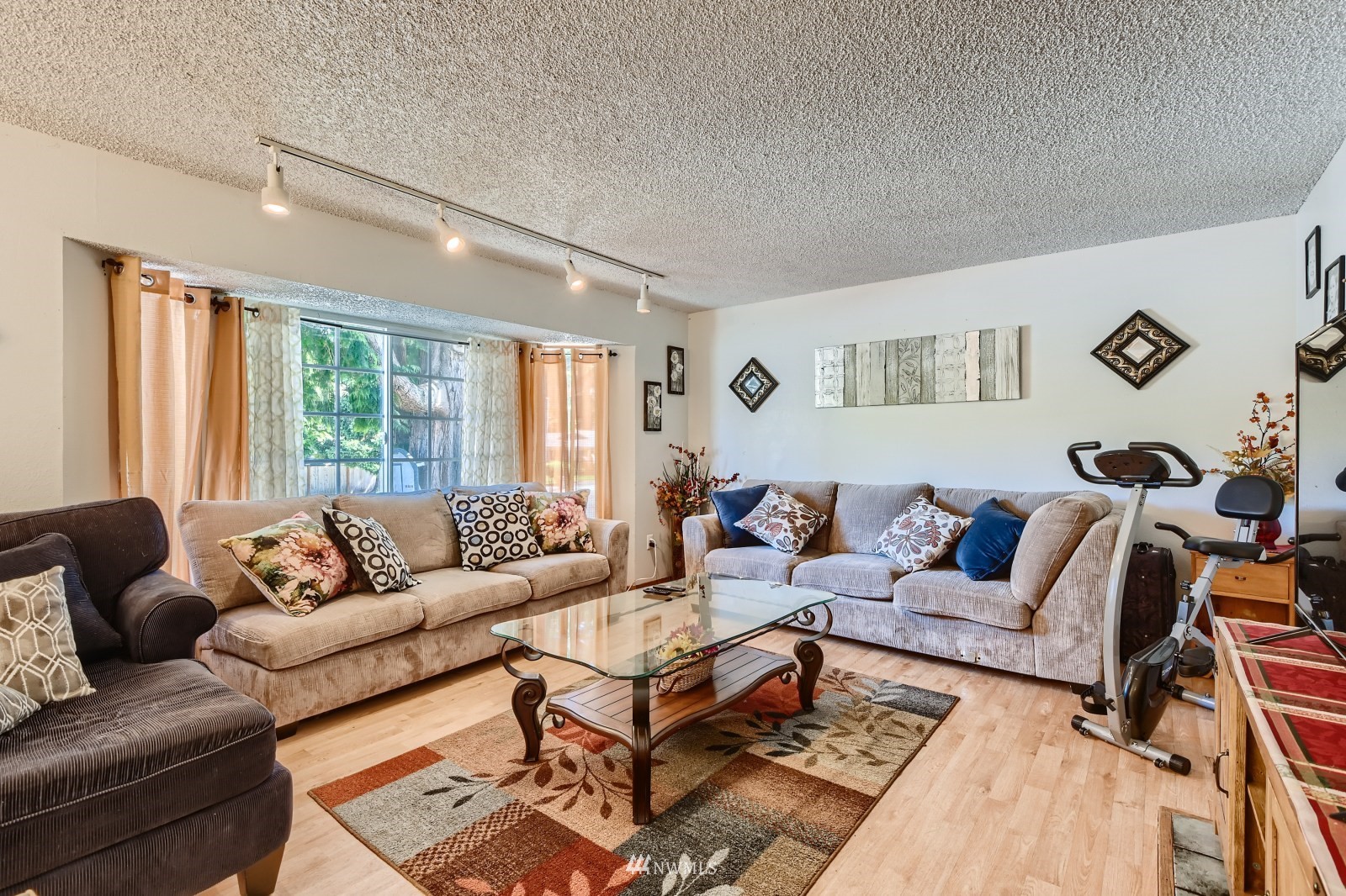 2926 165th Place Southeast Bothell, WA 98012 - Photo 2 of 11 a living room with furniture and a large window