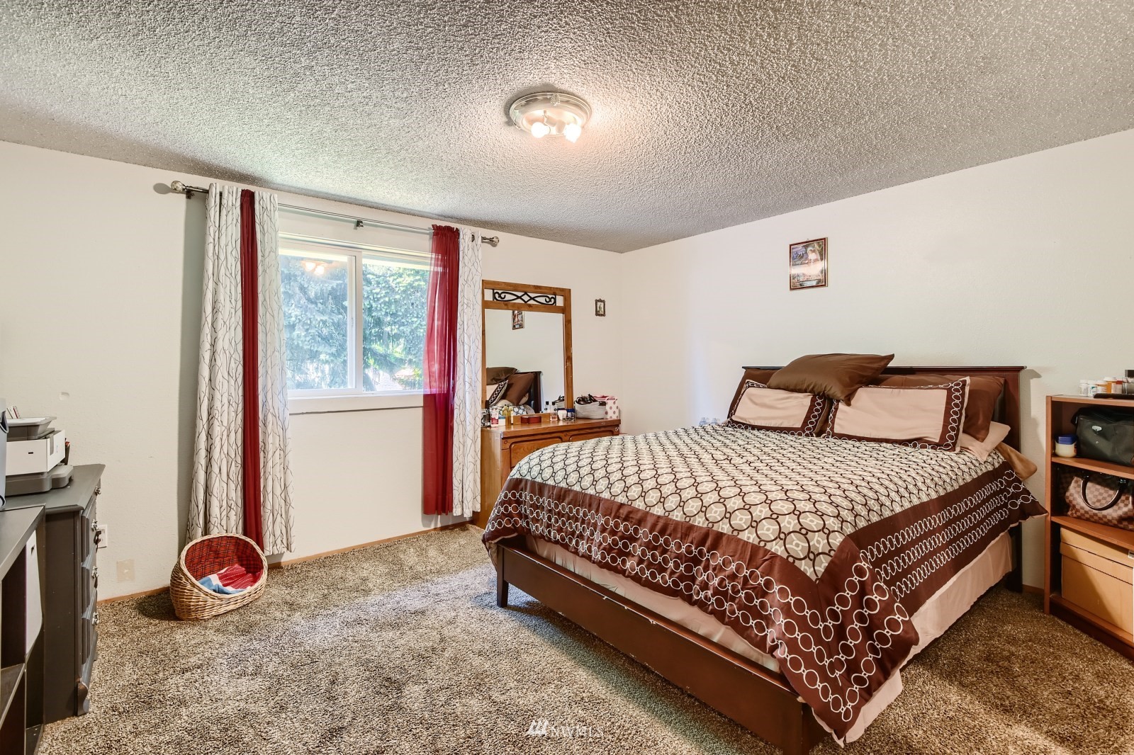 2926 165th Place Southeast Bothell, WA 98012 - Photo 5 of 11 a bedroom with a bed and a window