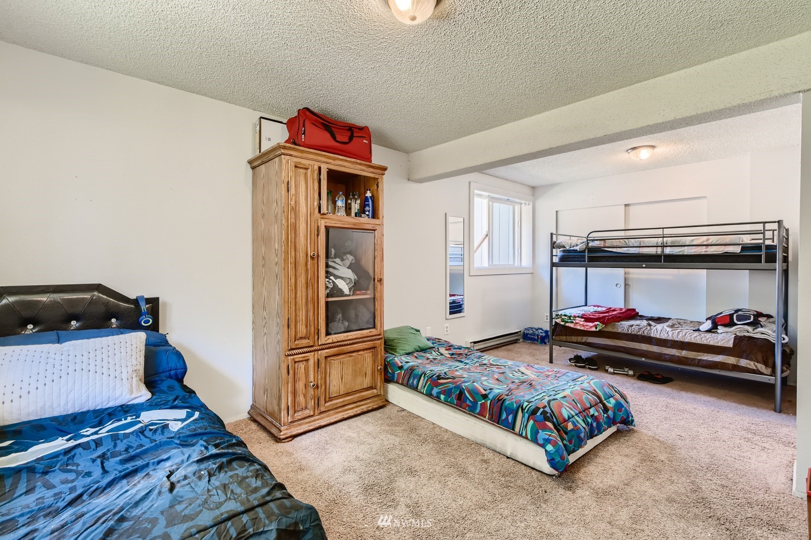 2926 165th Place Southeast Bothell, WA 98012 - Photo 8 of 11 a bedroom with furniture and a dresser