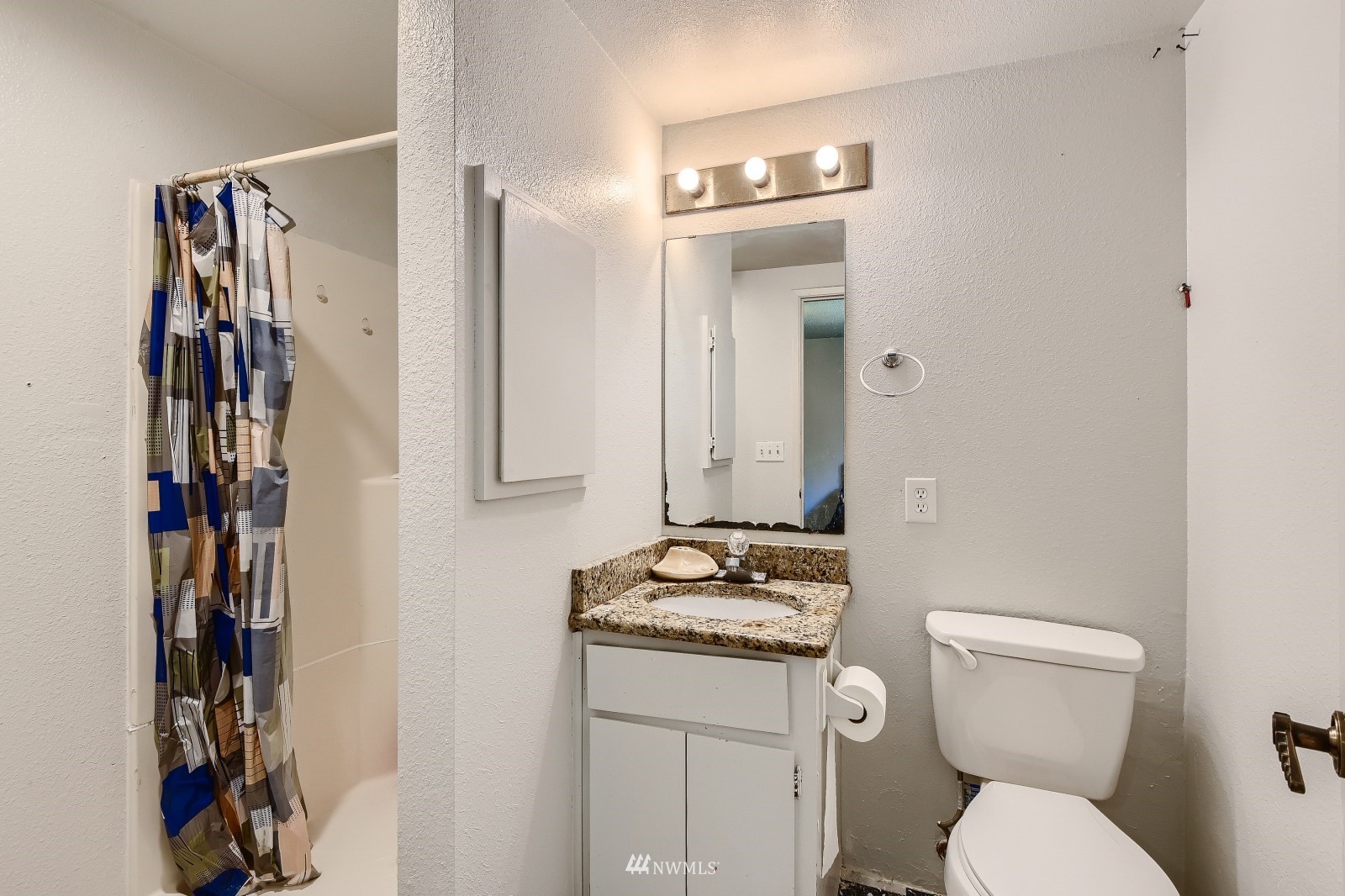 2926 165th Place Southeast Bothell, WA 98012 - Photo 9 of 11 a bathroom with a granite countertop sink toilet and shower